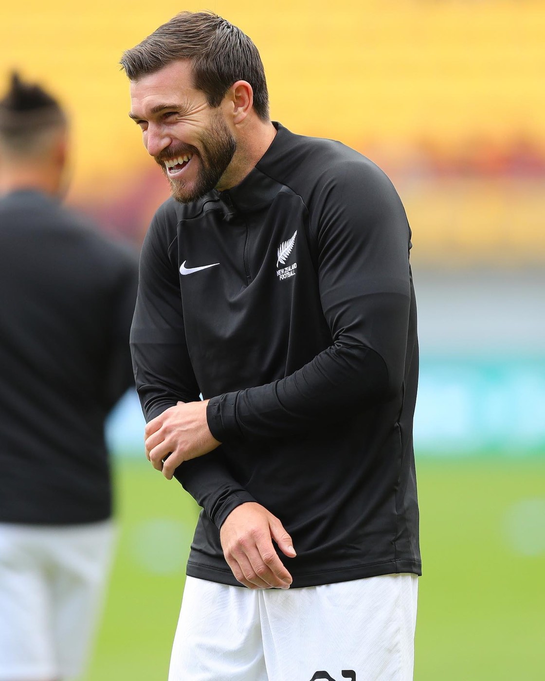 Tim Payne sonriendo en entrenamiento